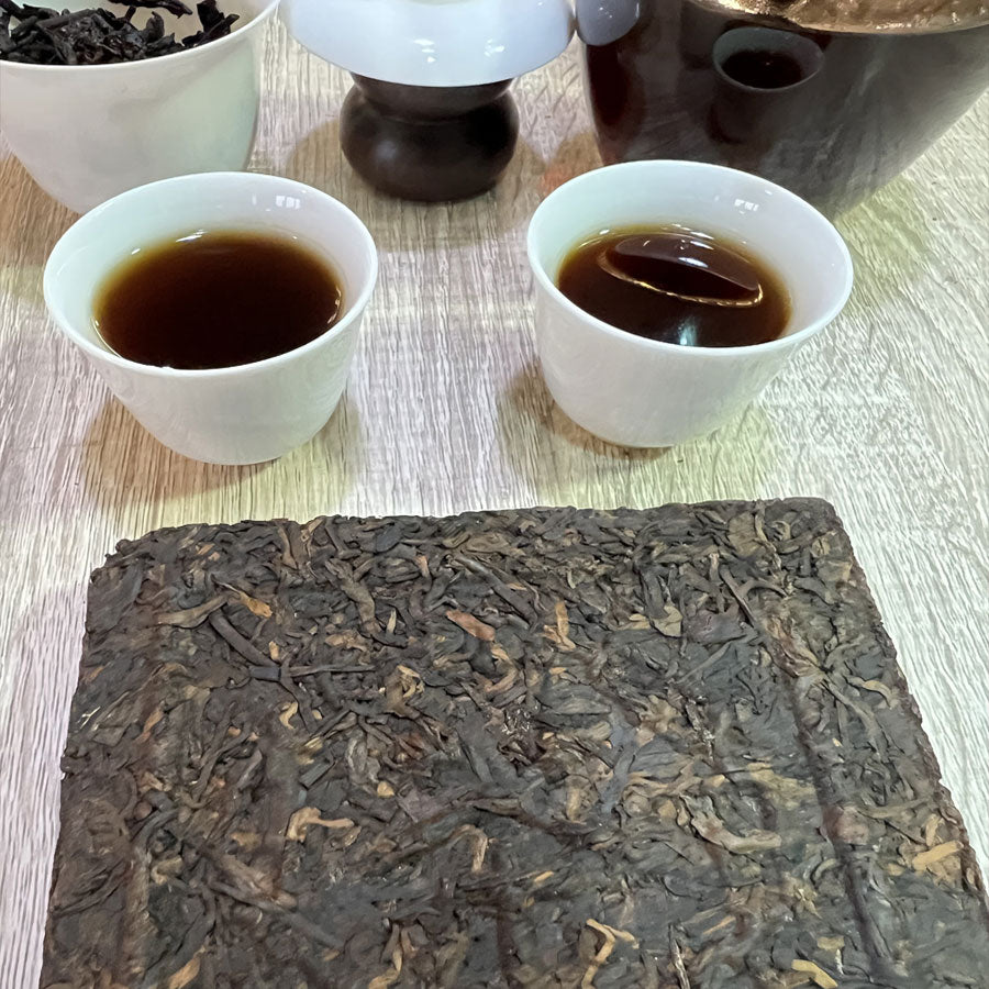 109 - Thés PUER Cuit brique carrée GONG XI FA CAI – Années 1990 – 250g - Lemeilleurthedechine